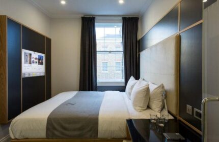 The Z Hotel Covent Garden room. Modern decor, double bed, TV, and window. Gay-friendly hotel for gay men travel in London.