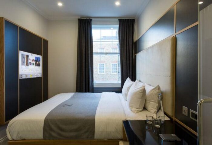 The Z Hotel Covent Garden room. Modern decor, double bed, TV, and window. Gay-friendly hotel for gay men travel in London.