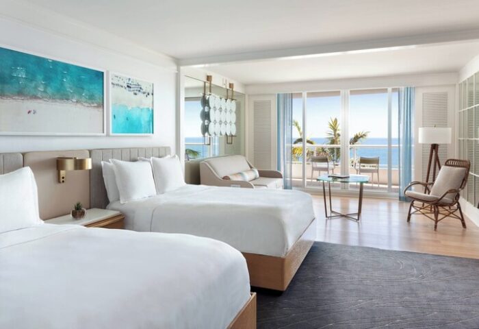 Ritz-Carlton, Fort Lauderdale, gay-friendly hotel room. Two beds, ocean view, balcony, seating area. Luxury travel for gay men. Coastal decor.