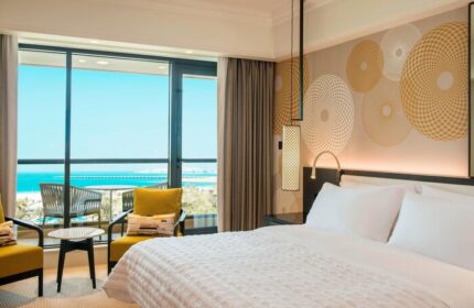 Le Royal Méridien Beach Resort room: Ocean view from this gay-friendly hotel. A luxurious bedroom with balcony seating and a king-size bed.