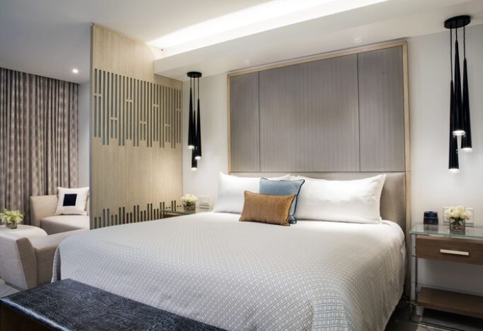 H2O Suites Adults Only gay-friendly hotel room. Modern design with king bed, stylish lighting, and comfortable seating. Ideal for gay travel.