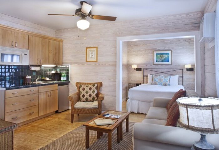 Island City House gay-friendly hotel room. Interior view of a suite with a kitchenette, living area, and bedroom. Cozy, comfortable space.
