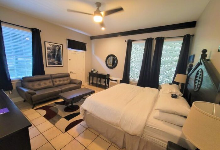 Equator Resort gay-friendly hotel room. Comfortable bed, sofa, and stylish decor. A welcoming space for gay travelers. Relaxing vacation.