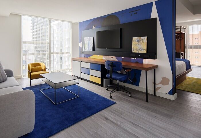 Hotel Indigo Miami Brickell room: Desk, TV, and seating area. A gay-friendly hotel with colorful decor and modern amenities. Perfect for gay travel.