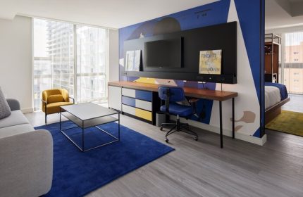 Hotel Indigo Miami Brickell room: Desk, TV, and seating area. A gay-friendly hotel with colorful decor and modern amenities. Perfect for gay travel.