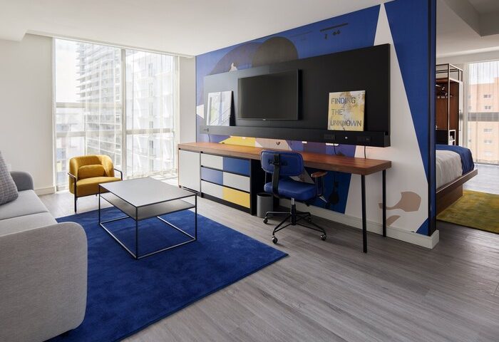 Hotel Indigo Miami Brickell room: Desk, TV, and seating area. A gay-friendly hotel with colorful decor and modern amenities. Perfect for gay travel.