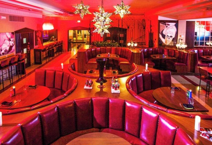 Dream South Beach, gay-friendly hotel. Red-lit lounge with booths, bar, star lights. Miami Beach nightlife. Gay travel advice. Hyatt hotel.