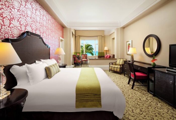 The Royal Hawaiian, a Luxury Collection Resort, Waikiki gay-friendly hotel room. Ocean view, stylish decor, and comfortable bed.