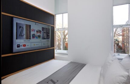The Z Hotel Trafalgar gay-friendly room: modern design, TV, window view. Ideal for gay travelers seeking comfort in London.