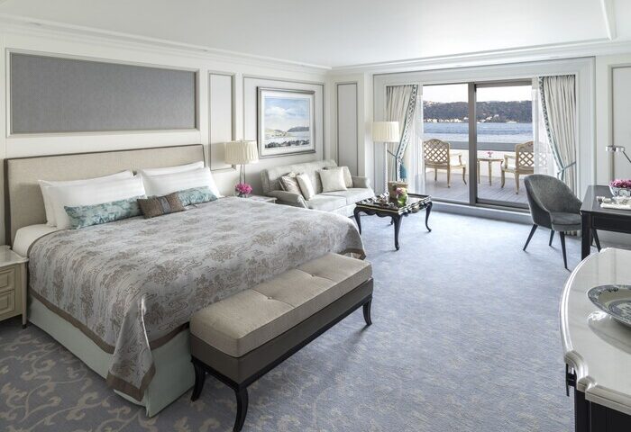 Shangri-La Bosphorus, Istanbul gay-friendly hotel room. King bed, sitting area, and balcony overlooking the Bosphorus. Luxury gay travel.