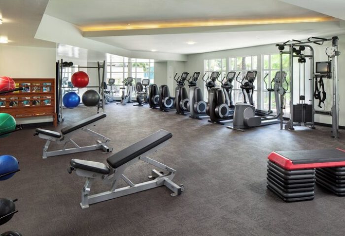 Gay-Friendly Hotel gym at Moana Surfrider, A Westin Resort & Spa, Waikiki Beach. Fitness center with weights, machines, and exercise equipment.