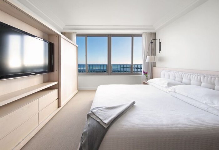 Modern Honolulu Hilton Vacation Club gay-friendly hotel room. Ocean view, TV, and minimalist design for gay travelers.