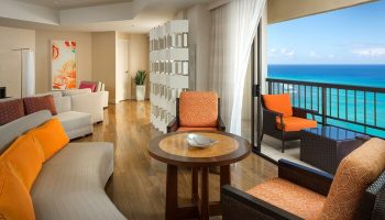 Hyatt Regency Waikiki Beach Resort suite. Gay-friendly hotel room with ocean view balcony. Waikiki travel for gay men. Spa resort interior.