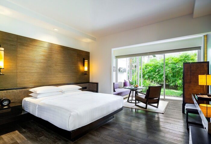 The Barai By Hyatt gay-friendly hotel room. King bed, lounge area, and garden view. A luxury travel experience for gay men.