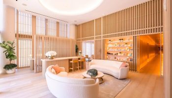 W South Beach hotel's chic, gay-friendly spa lounge. Modern design, light wood accents, and stylish seating. Luxury travel for gay men.