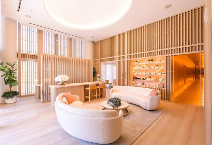 W South Beach hotel's chic, gay-friendly spa lounge. Modern design, light wood accents, and stylish seating. Luxury travel for gay men.