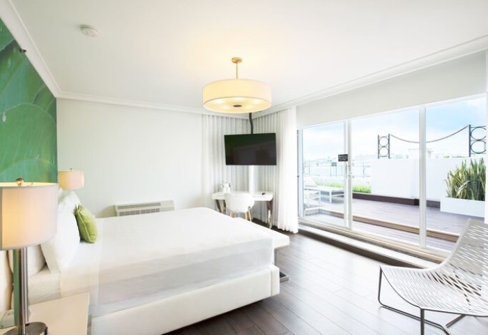 President Hotel gay-friendly room. Modern design with a balcony view. Comfortable bed, TV, and workspace. Ideal for gay travelers.