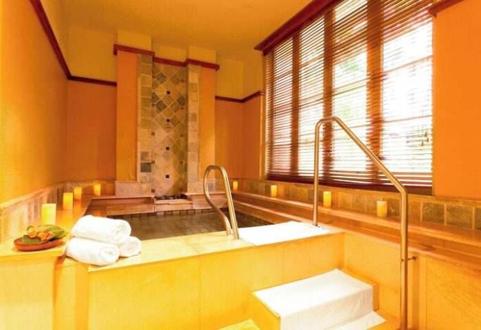 Royal Hawaiian, a Luxury Collection Resort, Waikiki gay-friendly hotel spa. Relaxing hot tub with towels and candles. Perfect for gay men's travel.