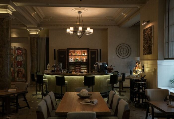 The Bank Hotel Istanbul bar area. Gay-friendly hotel interior with bar, tables, and chairs. Design Hotels™ member, stylish decor.