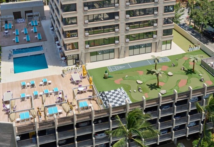 Holiday Inn Express Waikiki rooftop amenities: pool, mini golf, shuffleboard, giant chess. A gay-friendly hotel in Honolulu, Hawaii.