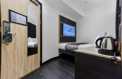 The Z Hotel Trafalgar: Interior of a gay-friendly hotel room. Single bed, TV, kettle, and mirror on the door. Modern design, comfortable for LGBT travelers.