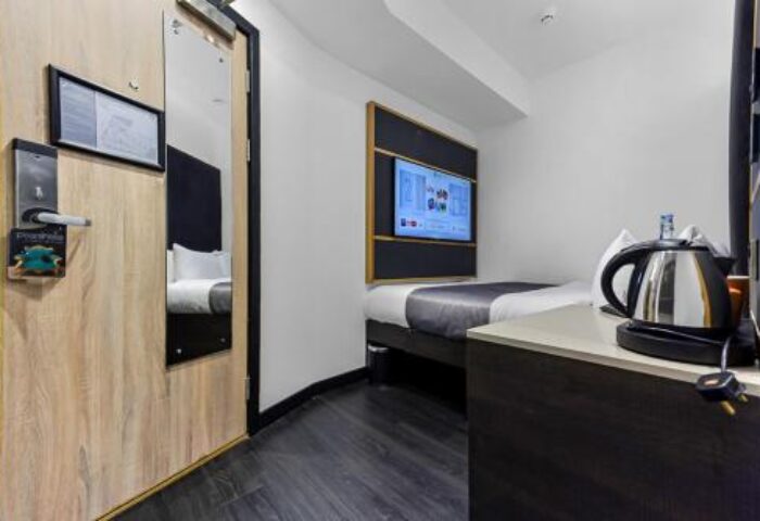 The Z Hotel Trafalgar: Interior of a gay-friendly hotel room. Single bed, TV, kettle, and mirror on the door. Modern design, comfortable for LGBT travelers.