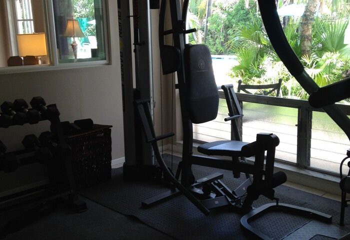 Gym at Gay-Friendly Cheston House Hotel. Clothing optional all male guesthouse with fitness center and weight training equipment.