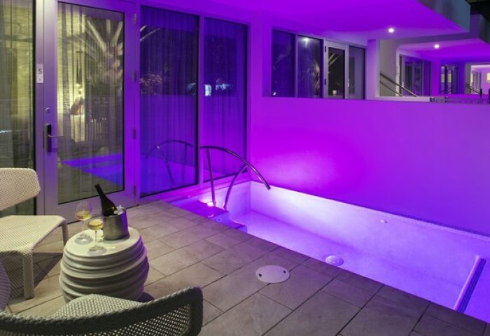 H2O Suites Adults Only gay-friendly hotel room with private pool, chairs, and wine. Key West gay travel destination for gay men.