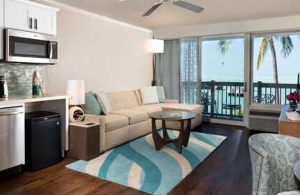 Opal Key Resort & Marina suite. Gay-friendly hotel room with kitchenette, couch, and balcony overlooking the ocean. Key West gay travel.