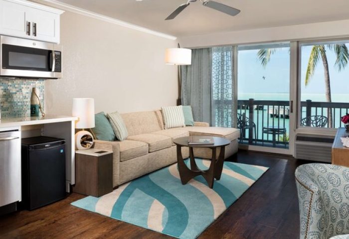 Opal Key Resort & Marina suite. Gay-friendly hotel room with kitchenette, couch, and balcony overlooking the ocean. Key West gay travel.