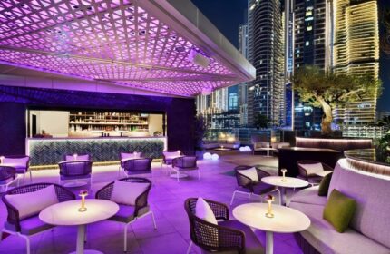 Hotel Indigo Dubai Downtown gay-friendly bar. Rooftop lounge with purple lighting, bar, city views. Perfect for gay travelers' nightlife.