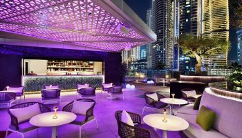 Hotel Indigo Dubai Downtown gay-friendly bar. Rooftop lounge with purple lighting, bar, city views. Perfect for gay travelers' nightlife.