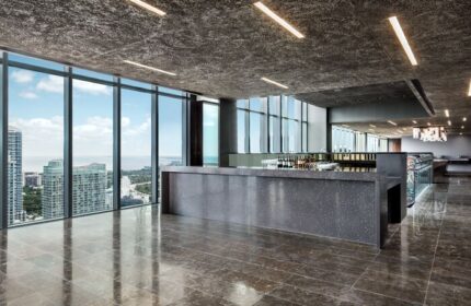 EAST Miami gay-friendly hotel bar. Sleek, modern design with floor-to-ceiling windows offering city views. Perfect for gay travelers seeking style.
