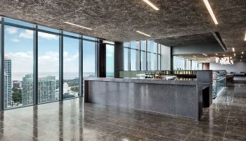 EAST Miami gay-friendly hotel bar. Sleek, modern design with floor-to-ceiling windows offering city views. Perfect for gay travelers seeking style.