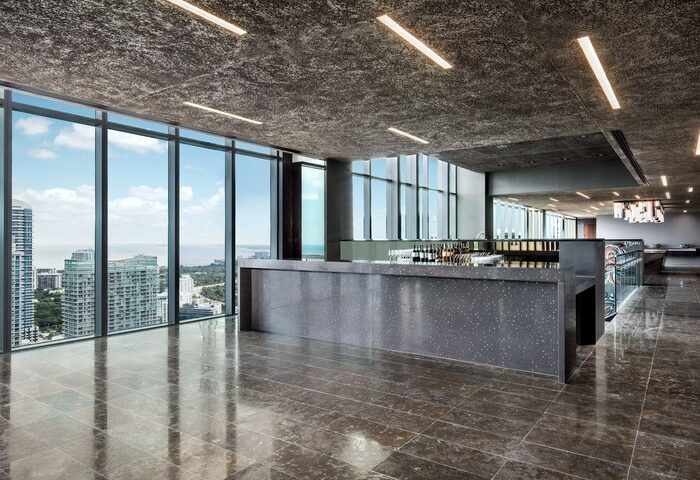EAST Miami gay-friendly hotel bar. Sleek, modern design with floor-to-ceiling windows offering city views. Perfect for gay travelers seeking style.