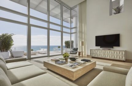 Four Seasons Hotel at The Surf Club: Oceanfront suite with floor-to-ceiling windows & balcony. Gay-friendly hotel for luxury travel.