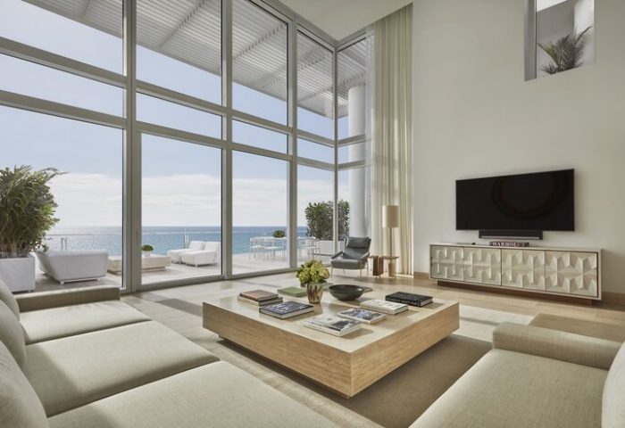 Four Seasons Hotel at The Surf Club: Oceanfront suite with floor-to-ceiling windows & balcony. Gay-friendly hotel for luxury travel.