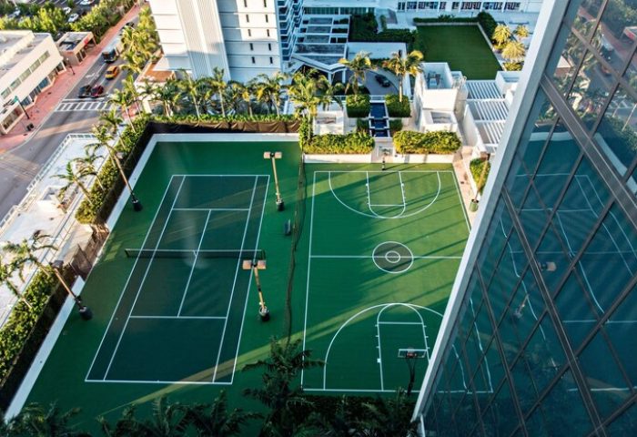 Aerial view of W South Beach gay-friendly hotel featuring tennis and basketball courts. A luxury travel destination for gay men.
