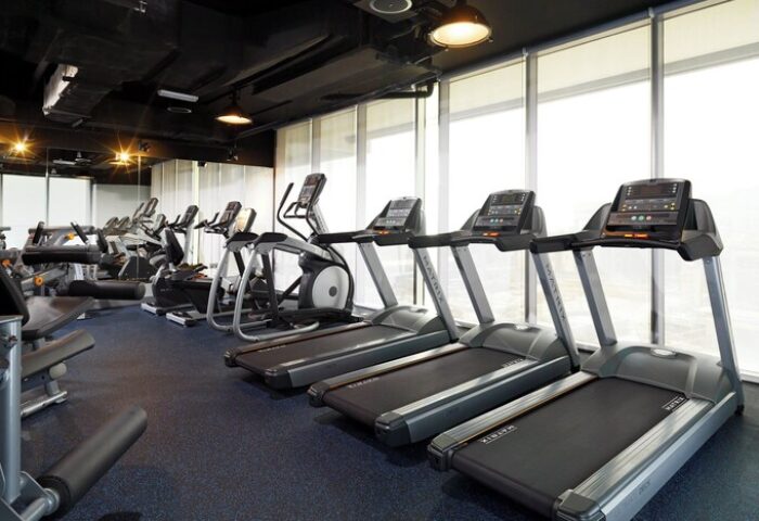 Aloft Palm Jumeirah gay-friendly hotel gym. Treadmills and exercise bikes in a modern fitness center. Great for gay men's travel.