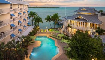 Hyatt Centric Key West Resort pool view. Gay-friendly hotel with spa, palm trees, and ocean. A tropical paradise for gay travelers.