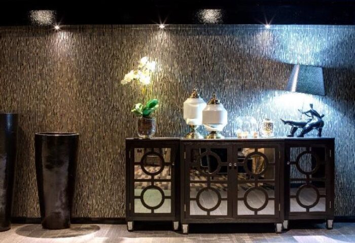 Interior of Gay-Friendly Hotel 57 Hotel. Mirrored cabinet with decor, lamps. Upscale design for gay men travelers seeking style.