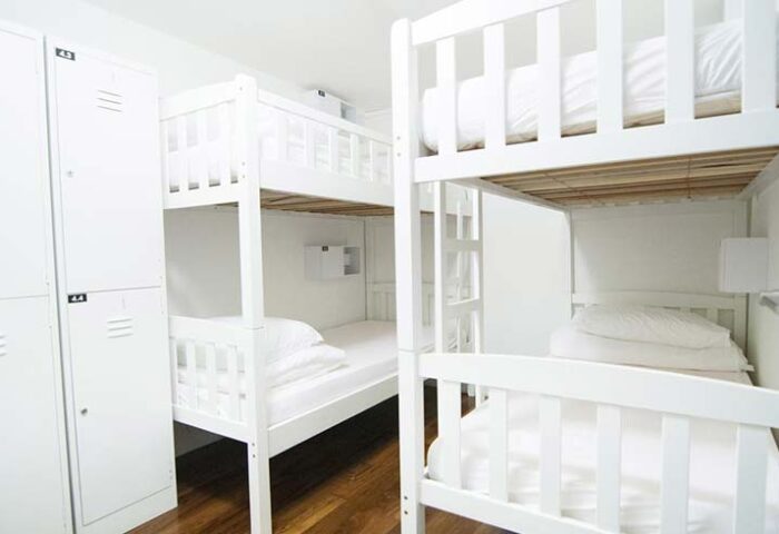 5footway.inn Project Chinatown dorm. Gay-friendly hotel with white bunk beds and lockers. Budget travel for gay men in Singapore's Chinatown.