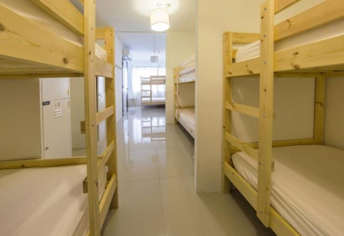 5footway.inn Project Chinatown gay-friendly hotel dorm. Bunk beds line a hall in this Chinatown hostel. Budget lodging for gay men travelers.
