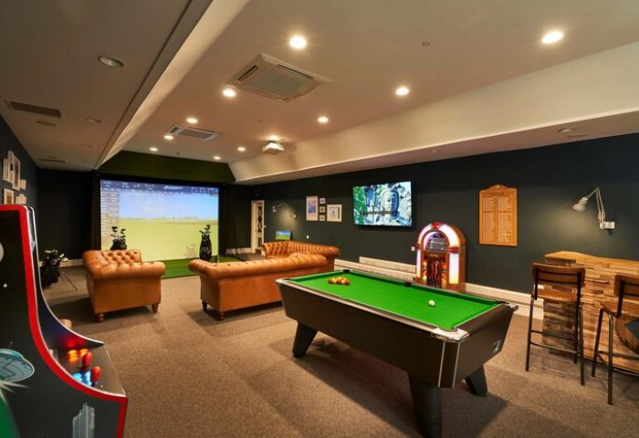 Crieff Hydro gay-friendly hotel games room. Billiards, jukebox, golf simulator, arcade game, and bar for gay men's travel advice.