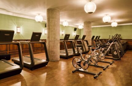 Soho House Istanbul gym. Treadmills and stationary bikes in a gay-friendly hotel. Fitness center with modern equipment.