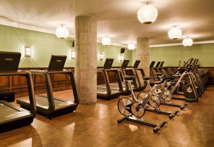 Soho House Istanbul gym. Treadmills and stationary bikes in a gay-friendly hotel. Fitness center with modern equipment.