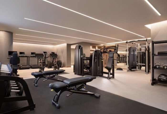 The Westin London City gay-friendly hotel gym. Modern fitness center with weights, benches, treadmills, and exercise machines.