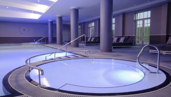 Fairmont St Andrews, Scotland gay-friendly hotel. Indoor pool and hot tub with lounge chairs. Ideal for gay men travel advice.