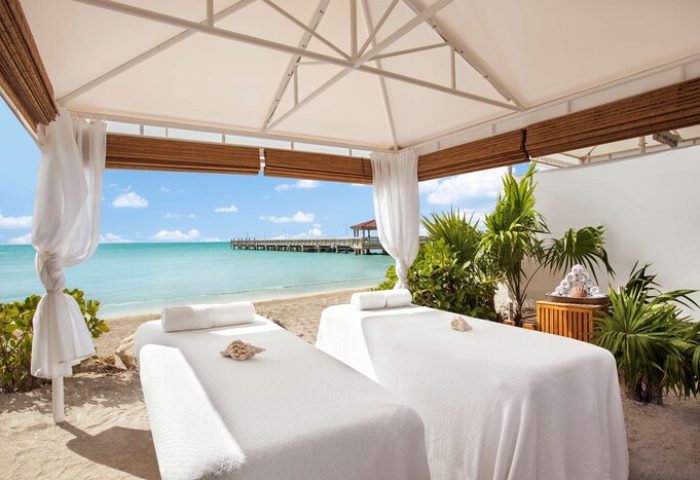 Casa Marina Key West's gay-friendly spa. Two massage beds under a canopy on the beach. Ocean view. Relaxing Key West experience.
