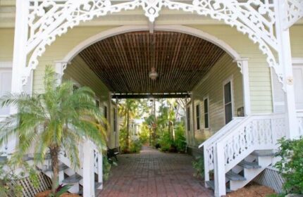Island City House, a gay-friendly hotel. Covered walkway with tropical plants. Key West gay travel lodging, architecture, and design.